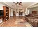 Spacious living area with open floor plan, connecting to the kitchen, featuring tile flooring and comfortable seating at 1462 Mt Laurel Dr, Winter Springs, FL 32708