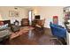 Comfortable living room featuring hardwood floors, a rocking chair, and ample seating at 1462 Mt Laurel Dr, Winter Springs, FL 32708