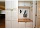 Functional mudroom featuring ample storage, a bench, and coat hooks, providing organization and convenience at 1462 Mt Laurel Dr, Winter Springs, FL 32708