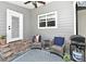 Cozy patio with comfortable seating and an outdoor grill at 1462 Mt Laurel Dr, Winter Springs, FL 32708