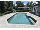 Sparkling in-ground pool with brick patio, chaise lounges, and nearby home exterior at 1462 Mt Laurel Dr, Winter Springs, FL 32708