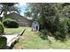 Backyard exterior of outdoor building with dark trim at 1462 Mt Laurel Dr, Winter Springs, FL 32708
