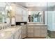 Elegant bathroom with marble countertops, custom cabinets, and decorative lighting features at 1600 N Wind Ct, Winter Springs, FL 32708