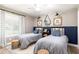 Shared bedroom with 2 twin beds and comfortable seating at 1600 N Wind Ct, Winter Springs, FL 32708