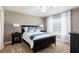 Bedroom offers a tranquil setting with natural light, cozy carpeting and sleek decor at 1600 N Wind Ct, Winter Springs, FL 32708