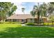 Charming one-story home featuring a well-manicured lawn and lush landscaping at 1600 N Wind Ct, Winter Springs, FL 32708