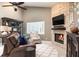 Cozy living room featuring a stone fireplace and comfortable seating at 1600 N Wind Ct, Winter Springs, FL 32708