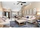 Spacious living room with vaulted ceilings, lots of natural light and adjoined dining room at 1600 N Wind Ct, Winter Springs, FL 32708