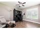 Bright office with herringbone floors, a large window, and stylish furnishings at 1600 N Wind Ct, Winter Springs, FL 32708