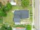 Bird's eye view of the property showcasing the new roof, surrounding trees, and proximity to the street at 161 Bolender Rd, Auburndale, FL 33823