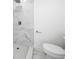 Contemporary bathroom with a marble-tiled shower and modern fixtures at 161 Bolender Rd, Auburndale, FL 33823