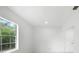 Bedroom featuring hardwood floors and natural light from a large window at 161 Bolender Rd, Auburndale, FL 33823