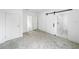 Spacious bedroom featuring a modern barn door leading to the bathroom at 161 Bolender Rd, Auburndale, FL 33823