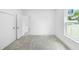 Bright bedroom with soft carpet, fresh white walls, and a large window, creating a serene retreat at 161 Bolender Rd, Auburndale, FL 33823