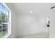 Bedroom offering a sunny view and easy access to the kitchen at 161 Bolender Rd, Auburndale, FL 33823