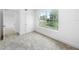 Inviting bedroom with soft carpet, bright white paint, and a large window with neighborhood views at 161 Bolender Rd, Auburndale, FL 33823