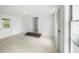 Bright bonus room with fresh paint, wood-look floors, new windows and exterior access at 161 Bolender Rd, Auburndale, FL 33823