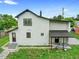 Exterior elevation showcasing backyard, new fence, green space, and access to covered patio at 161 Bolender Rd, Auburndale, FL 33823