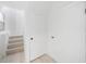 Bright hallway featuring natural light from a window and stairs leading to another level of the home at 161 Bolender Rd, Auburndale, FL 33823