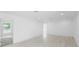 Spacious living room with sleek, light wood floors, recessed lighting, and neutral decor at 161 Bolender Rd, Auburndale, FL 33823