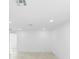 Bright living room with light floors, recessed lighting, and fresh white walls, exuding modern minimalist charm at 161 Bolender Rd, Auburndale, FL 33823