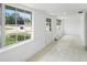 Bright sun room with tiled flooring, showcasing its ample natural light and access to the outdoors at 161 Bolender Rd, Auburndale, FL 33823