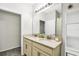 Bathroom featuring double sinks, neutral color palette, large mirror, and an abundance of natural light at 1821 Benevento St, St Cloud, FL 34771