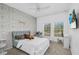 Cozy bedroom with soft rug, a bed, two windows, and Parisian themed wallpaper at 1821 Benevento St, St Cloud, FL 34771