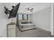 Comfortable bedroom with wall-mounted television, neutral color palette, and an inviting space at 1821 Benevento St, St Cloud, FL 34771