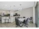 Kitchen dining area with modern lighting and backyard access at 1821 Benevento St, St Cloud, FL 34771