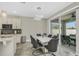 Dining area adjacent to kitchen with sliding glass doors to patio at 1821 Benevento St, St Cloud, FL 34771