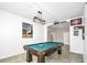 Recreation room featuring a pool table, baseball memorabilia and plenty of light at 1821 Benevento St, St Cloud, FL 34771