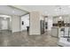 Open kitchen and living area with modern appliances and tile flooring at 1821 Benevento St, St Cloud, FL 34771