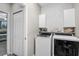 Laundry room featuring Whirlpool washer and dryer and modern accents at 1821 Benevento St, St Cloud, FL 34771