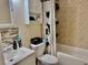 The bathroom features tile walls, a shower-tub combo, and a sleek vanity with storage at 2 Clear Pl, Ocala, FL 34472