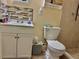 Bathroom with commode and sink with vanity and updated backsplash at 2 Clear Pl, Ocala, FL 34472