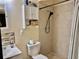 Compact bathroom featuring a tiled shower, vanity, and a toilet at 2 Clear Pl, Ocala, FL 34472