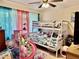 A playful bedroom with bunk beds, colorful curtains, and fun decor at 2 Clear Pl, Ocala, FL 34472