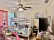 Cozy bedroom featuring a bunk bed, ceiling fan, and playful decor at 2 Clear Pl, Ocala, FL 34472