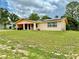 Charming one-story home featuring solar panels and a well-maintained front yard at 2 Clear Pl, Ocala, FL 34472