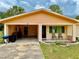 Charming one-story home boasts a covered carport, inviting front entrance, and well-kept yard at 2 Clear Pl, Ocala, FL 34472