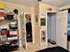 Hallway shows multiple doorways and metal shelving for storage, providing easy access to rooms at 2 Clear Pl, Ocala, FL 34472