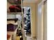 Hallway features metal shelving and an entrance to another room, providing ample storage at 2 Clear Pl, Ocala, FL 34472