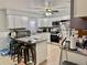 Modern kitchen with granite countertops, tile backsplash, stainless steel appliances, and a center island at 2 Clear Pl, Ocala, FL 34472