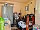 A compact utility room with metal cabinets and standard laundry equipment at 2 Clear Pl, Ocala, FL 34472