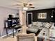 Comfortable living room featuring a plush sectional sofa, contemporary decor, and tile flooring at 2 Clear Pl, Ocala, FL 34472