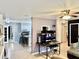 Open concept space features a kitchen with bar seating, blending into a cozy living room at 2 Clear Pl, Ocala, FL 34472