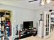 Cozy living room features neutral paint, tile floors, and an open doorway to the kitchen at 2 Clear Pl, Ocala, FL 34472