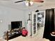 This living room features neutral paint, tile flooring, and a black curtain at 2 Clear Pl, Ocala, FL 34472