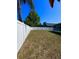Spacious fenced-in backyard, perfect for outdoor activities and pets, featuring a well-maintained lawn at 2049 Crosscreek Ct, Oviedo, FL 32766